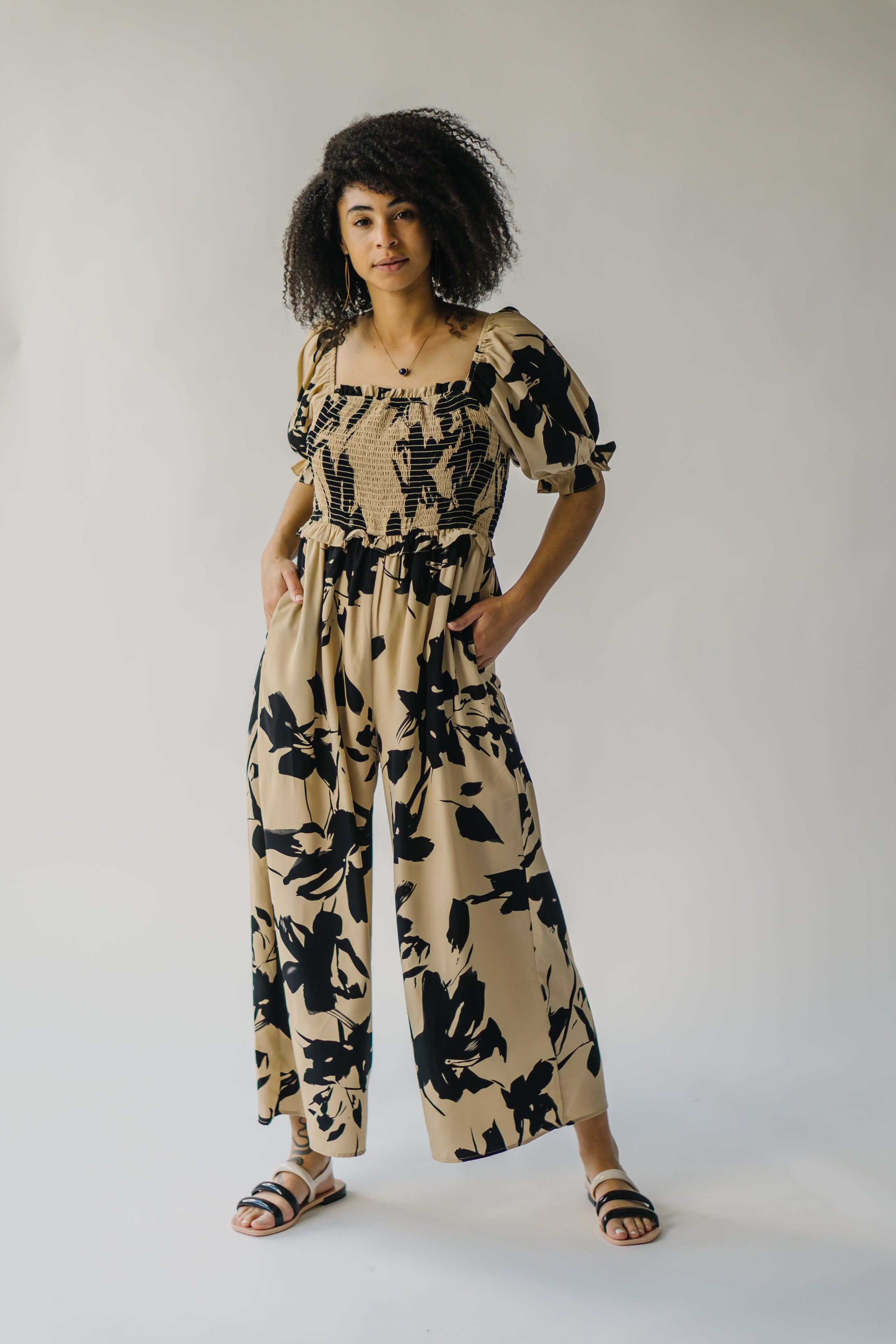 The Maggard Smocked Floral Jumpsuit in Taupe