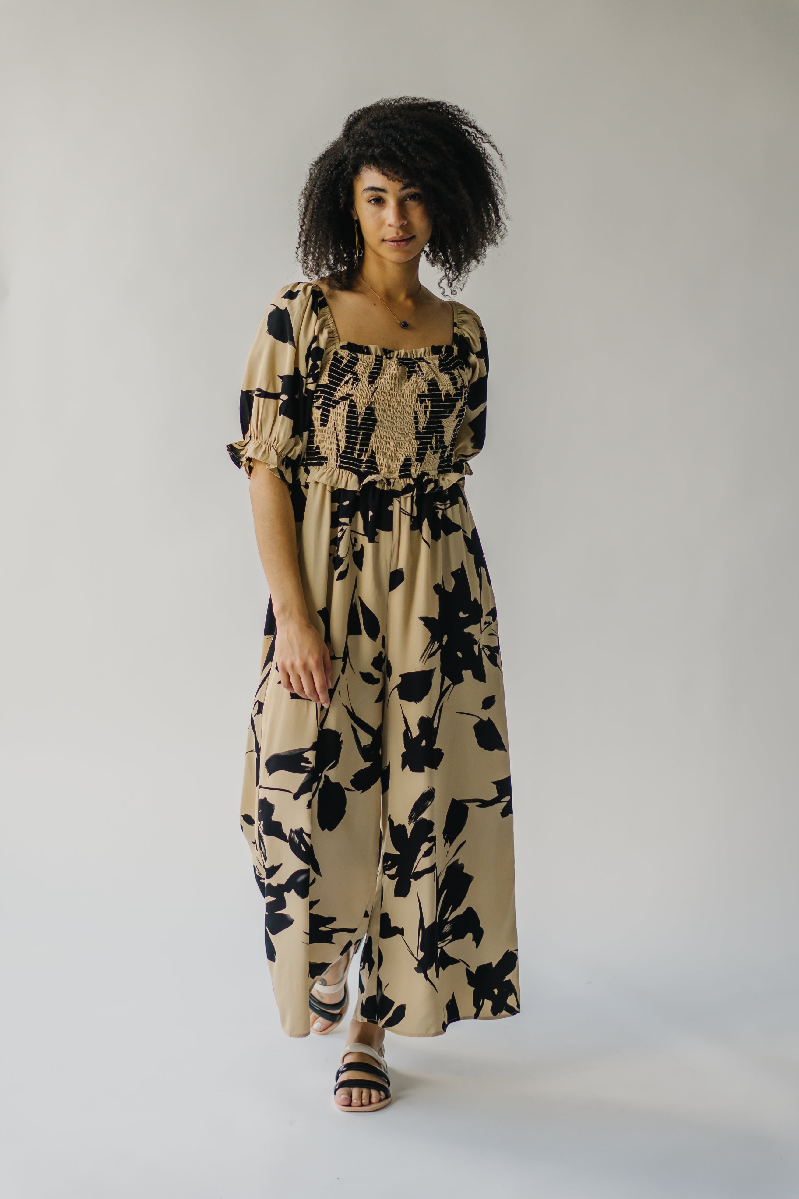 The Maggard Smocked Floral Jumpsuit in Taupe